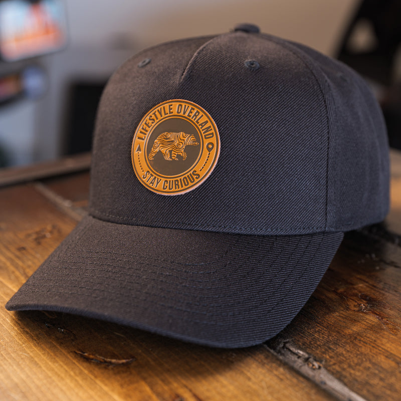 Load image into Gallery viewer, Lifestyle Overland Topo Bear Wool Snapback Hat with Leather Logo Patch
